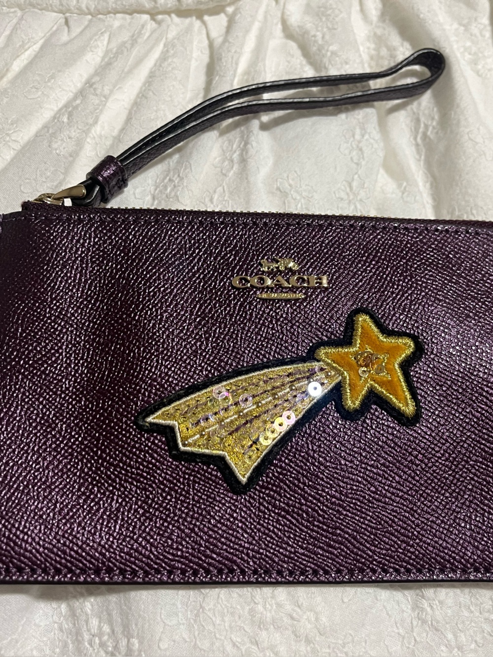COACH Plum Leather Wristlet with Gold Shooting Star Patch